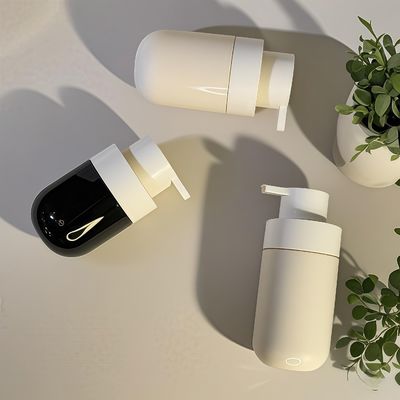 Flacone cosmetico in PET di forma rotonda e grassa con pompa a pressione e serigrafia a colori personalizzati per l'imballaggio di bellezza