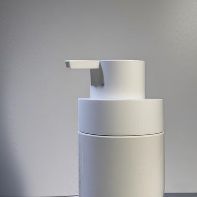 Flacone cosmetico in PET di forma rotonda e grassa con pompa a pressione e serigrafia a colori personalizzati per l'imballaggio di bellezza